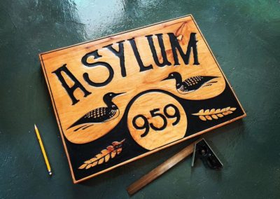 asylum wooden sign