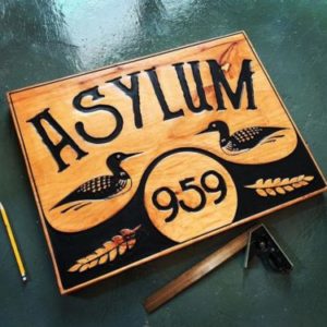 asylum wooden sign