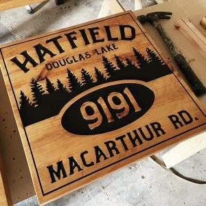 carved wood cabin address street name sign