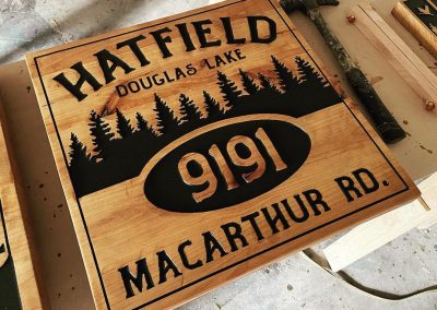 carved wood cabin address street name sign